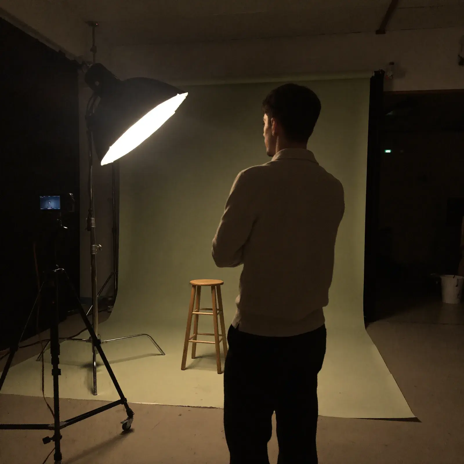 Ibraheem, founder of nime, watching a softbox-lit studio set in Brisbane